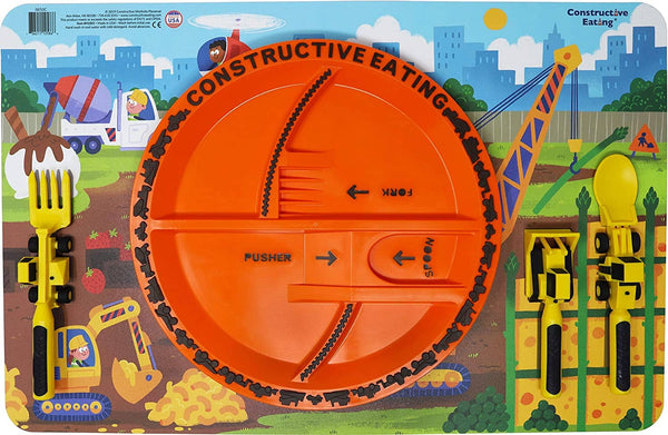 Constructive Eating dinner placement setting with orange divided plate on construction placemat with utensils on shaded area on placemat